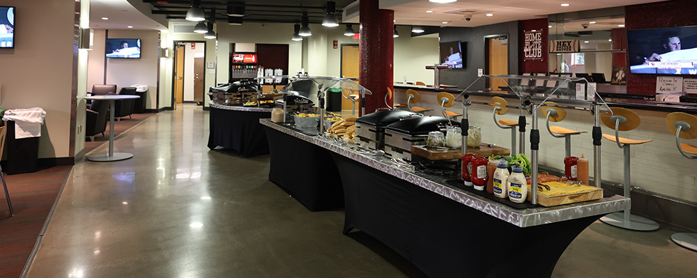 Large buffets with hamburgers and hot dogs