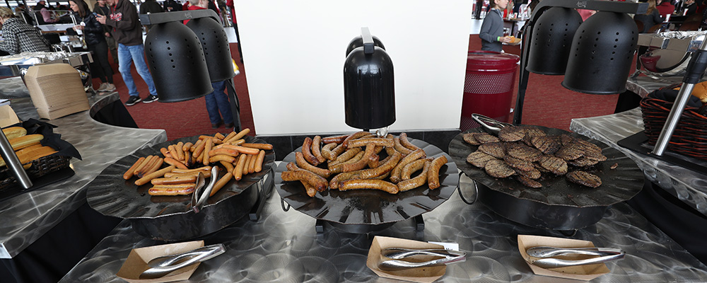 A buffet of hot dogs, sausages, and hamburgers