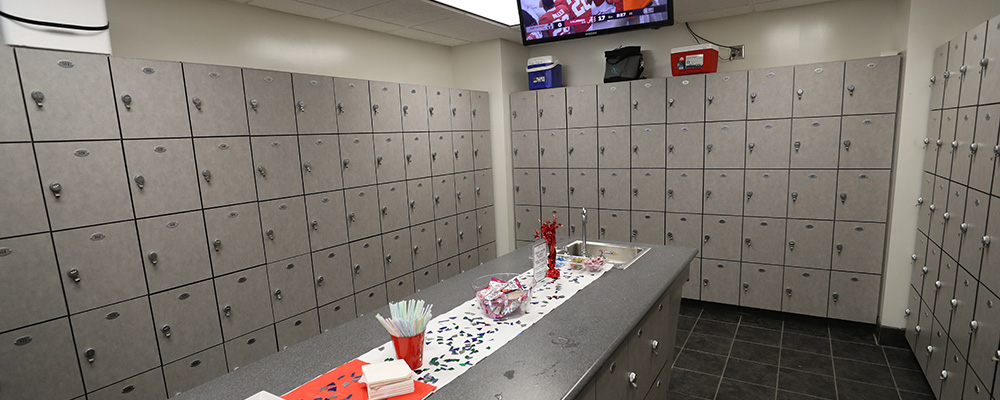 Locker room servicing the North Zone with a few snacks on a bar running the center of the room